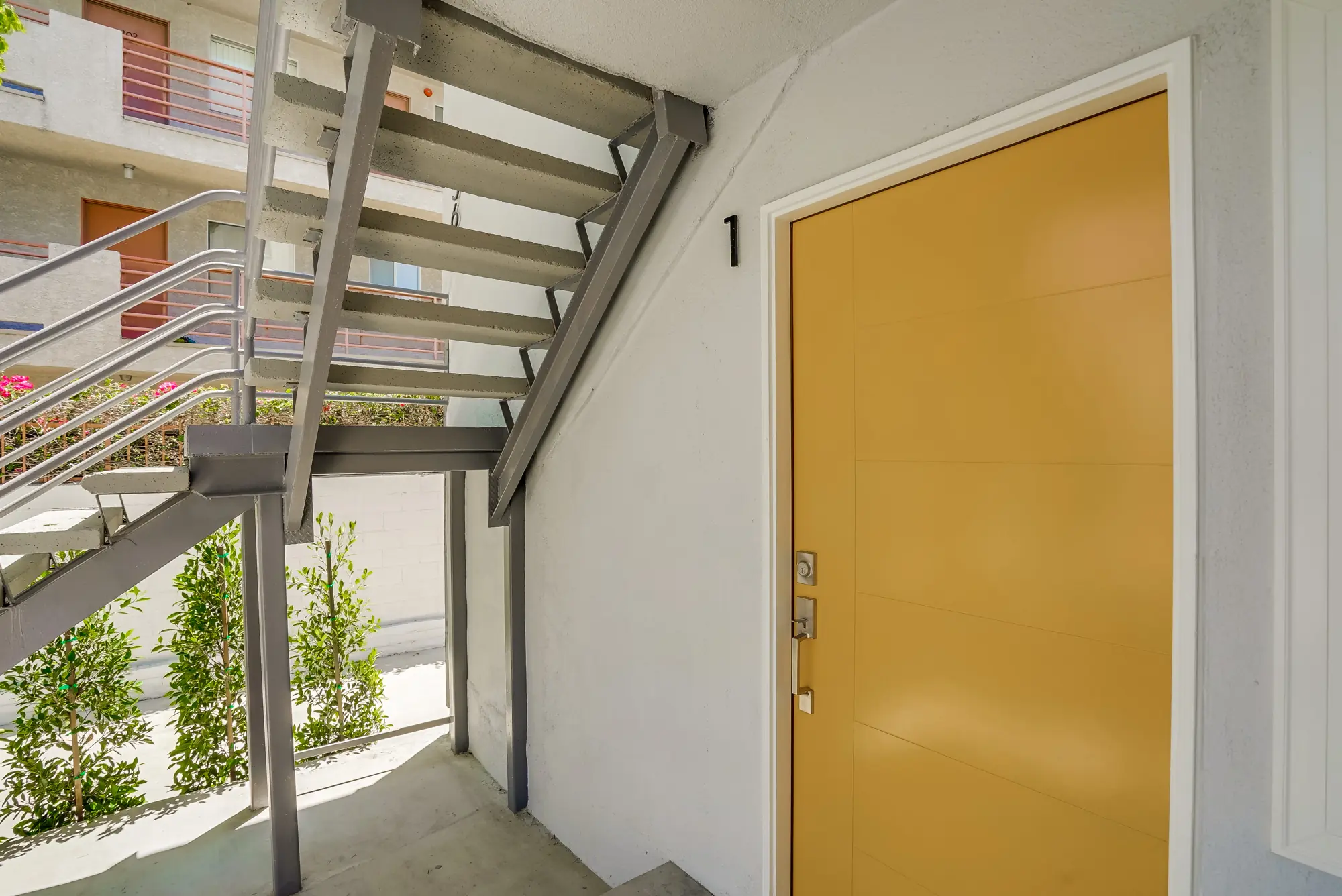 Renovated entry and stair at a Neilson Hammer building